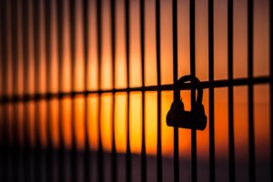 silhouette of padlock on window