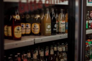 assorted flavor of wines and liquors on display in cabinet