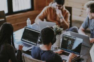 group of people using laptop computer