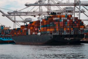 cargo ships docked at the pier during day